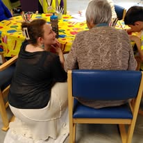 Group of diverse people engaging in a community activity at ACE Voices.